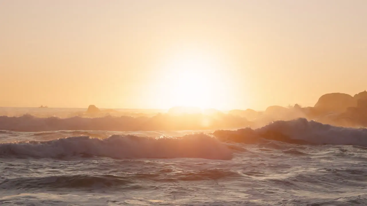 Beach waves and sunset background with night sky