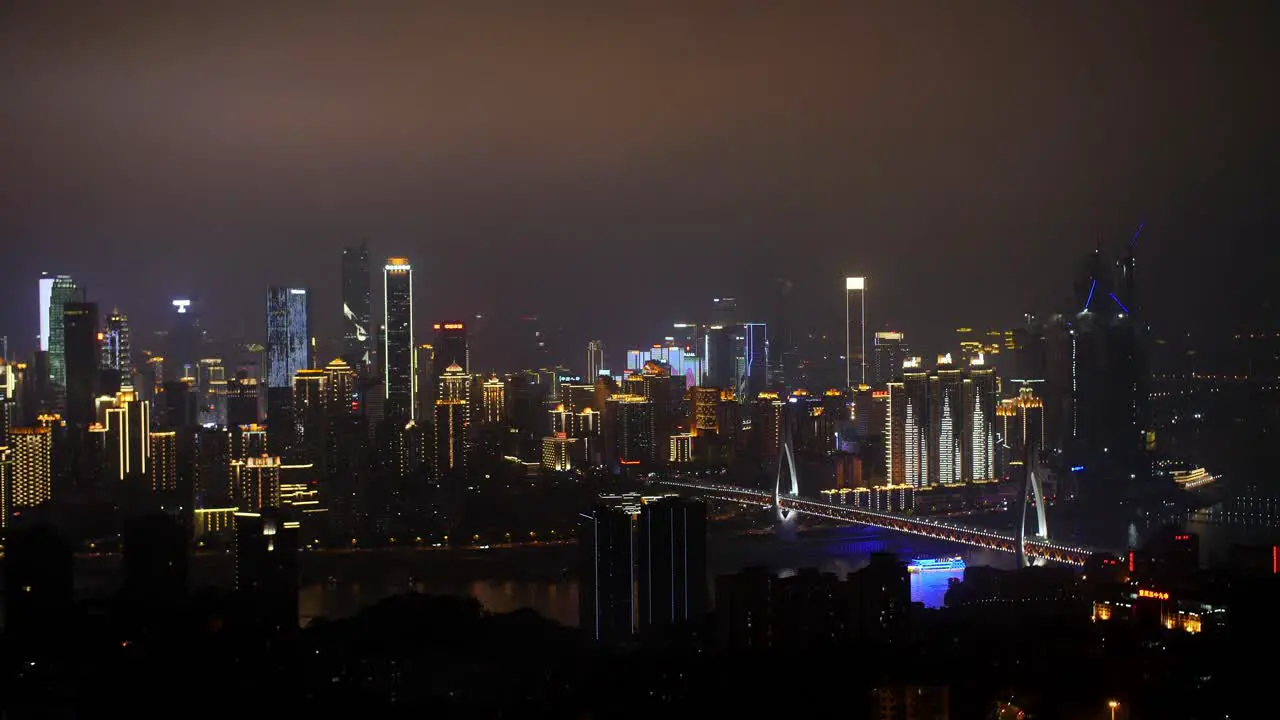 Skyline of the city showing the financial district and the Yang Gong Bridge at night Locked establishing shot