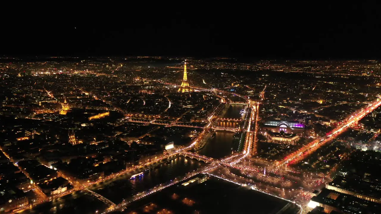 Centre of Paris by night aerial Eiffel tower la Seine river France city of light