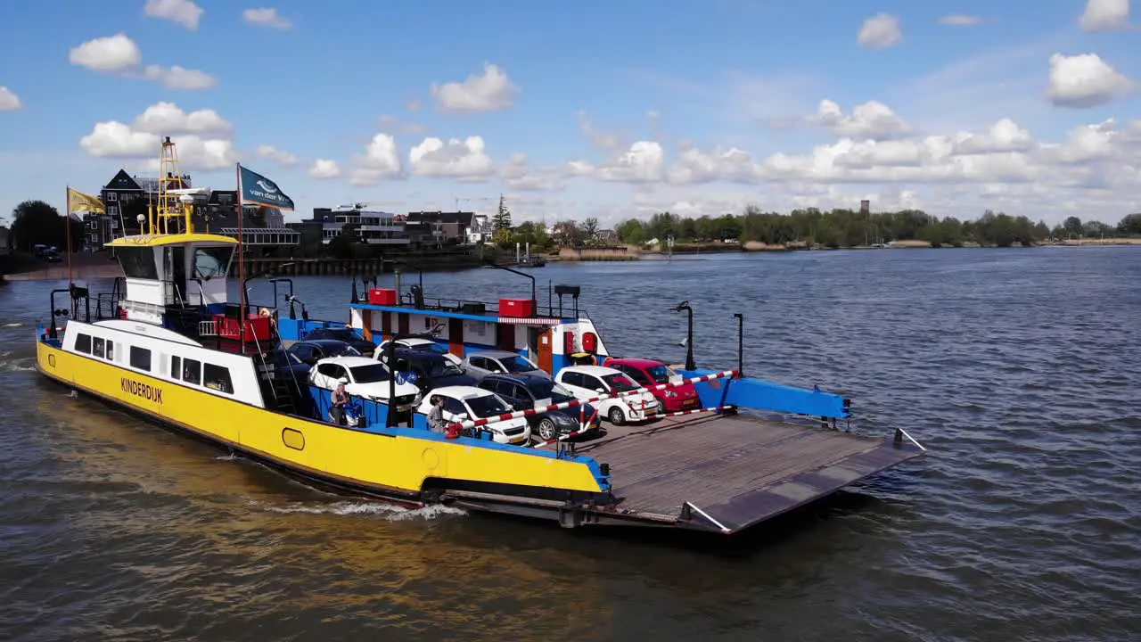 Conventional RORO Ferry Transporting Cars Across The River In Kinderjdijk Molenlanden Netherlands