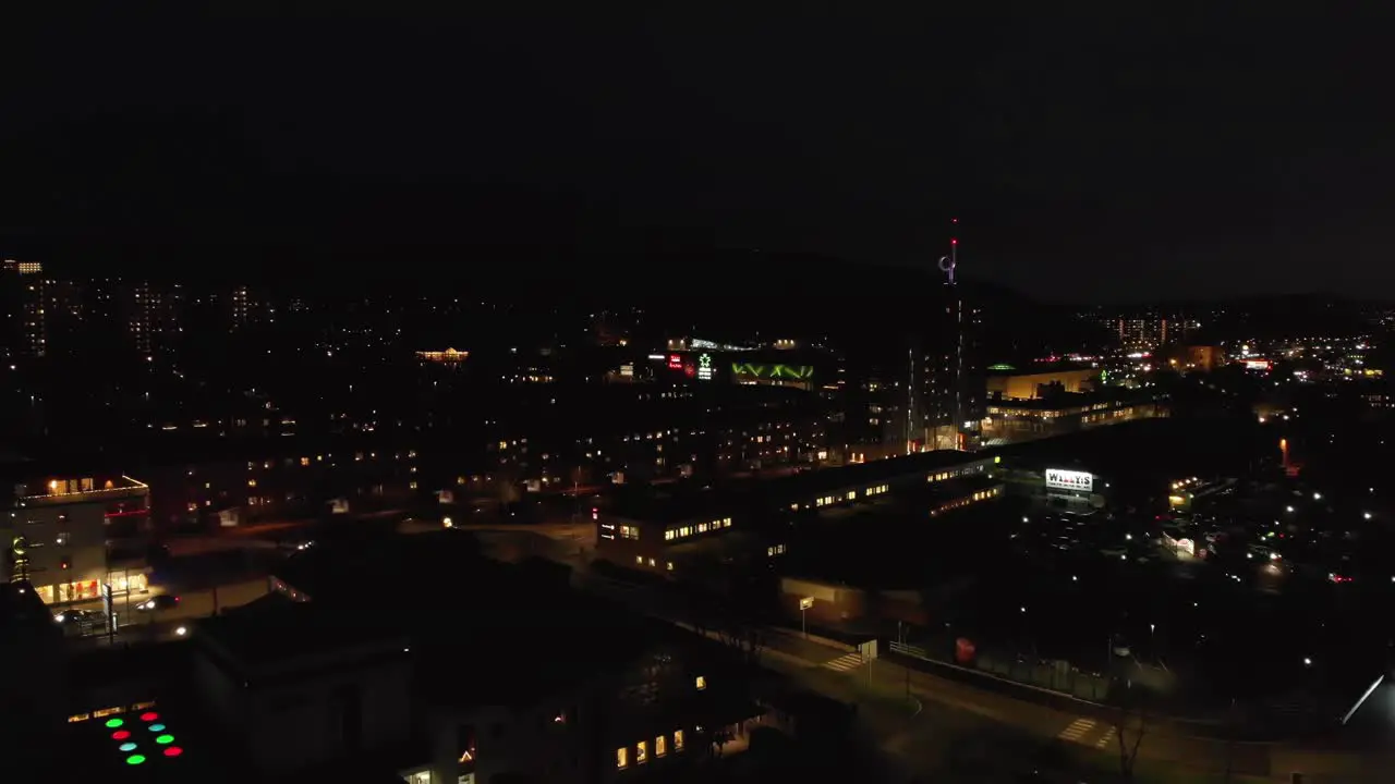 Aerial View of a city filled with colorful lights at night time