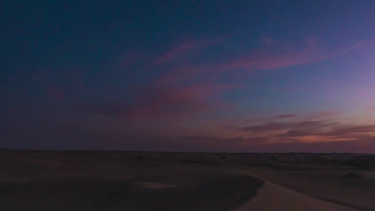 Amazing time lapse whip shot of Abu Dhabi desert Sand Dunes sunset to night time