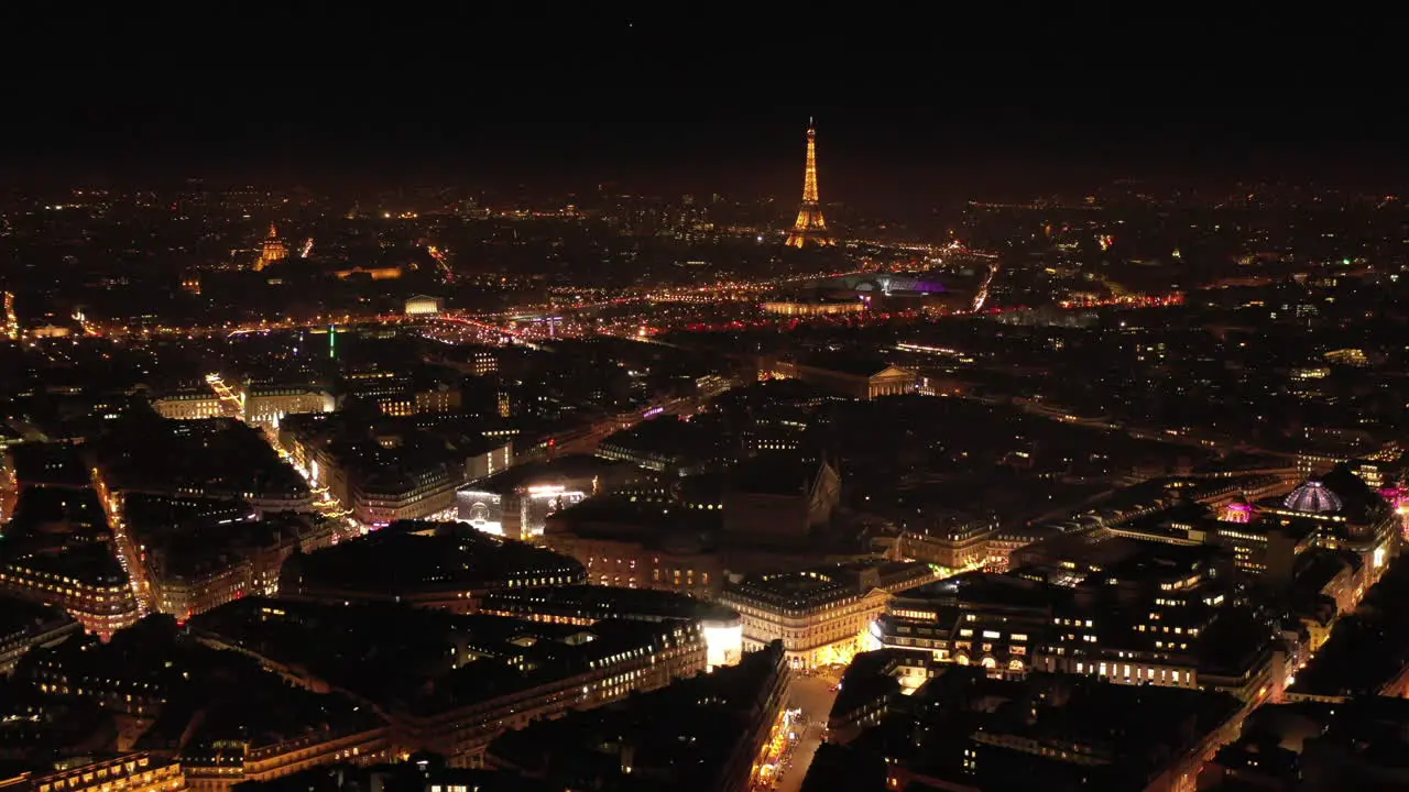 Paris city center by night aerial view lights in streets France Eiffel tower