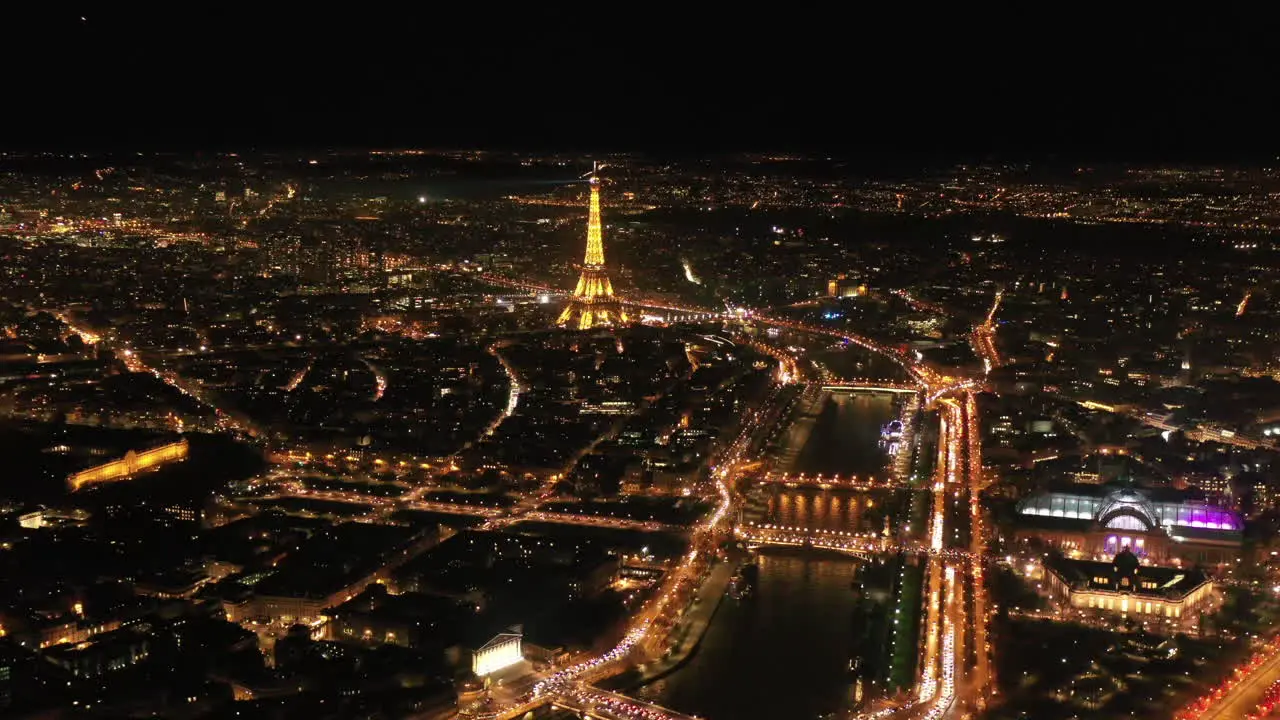 Paris at night Eiffel tower seine river aerial shot city of lights France