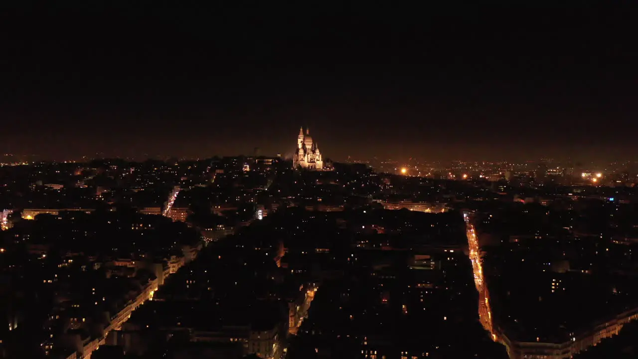 Basilica of the Sacred Heart of Paris by night aerial view Rochechouart district