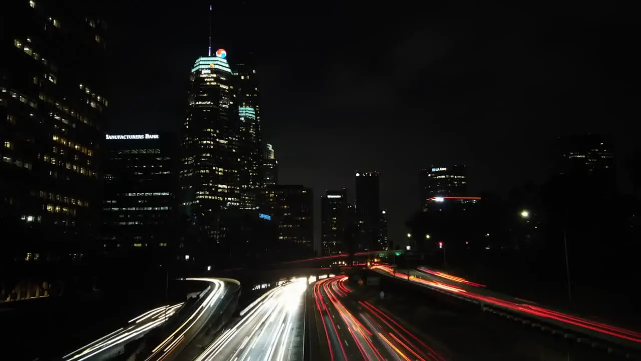 Downtown Los Angeles cityscape timelapse nightlife traffic light trails from driving vehicles