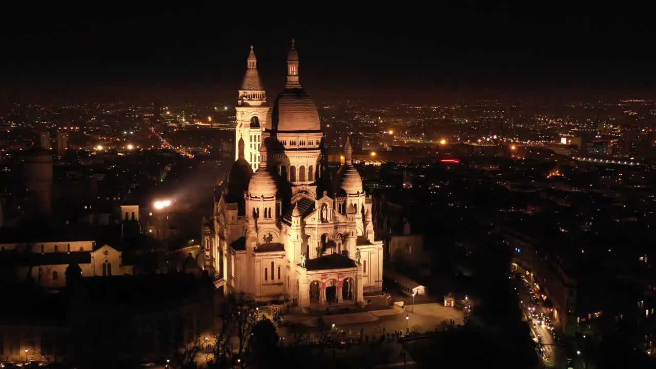 Night view of Basilica of the Sacred Heart of Paris aerial shot France