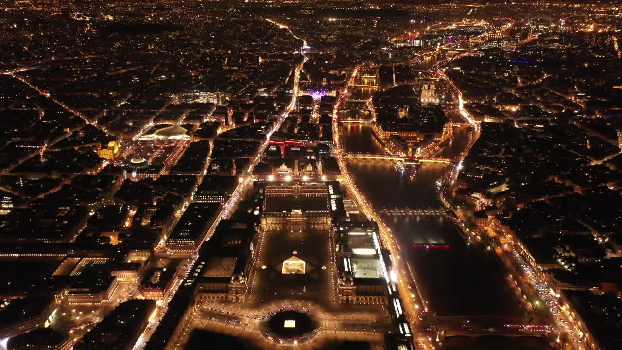 Museum le Louvre Paris by night aerial view la Seine river France