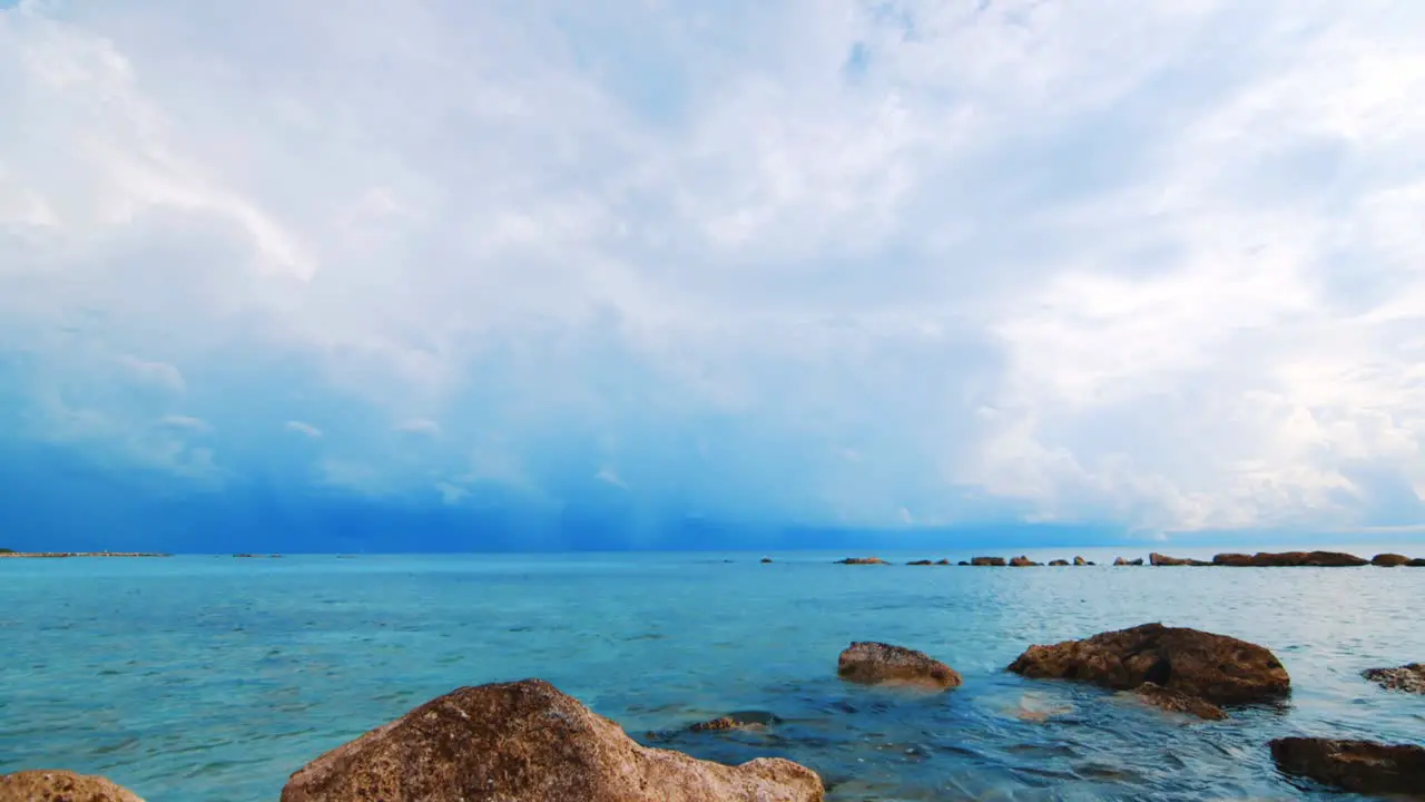 Slow Motion Caribbean Sea water lapping gently on rocks before storm