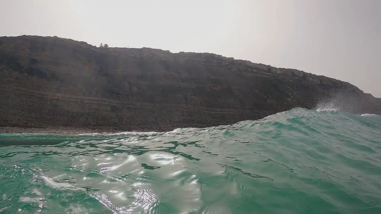 Surfer surfing ocean wave in Aguda beach Portugal