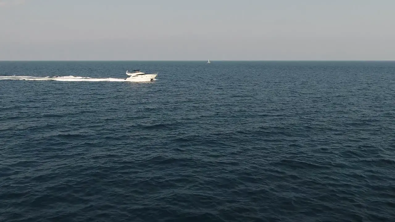 Aerial footage of a beautiful yacht cruising in the ocean near Antibes France