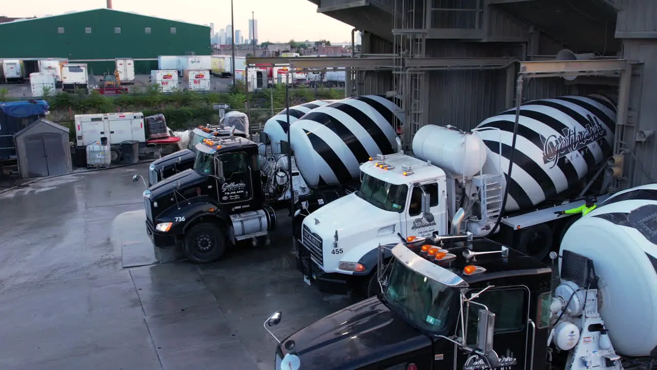 Brooklyn NYC USA Drone Shot of Heavy Trucks at Loading Station of Concrete Ready Mix Plant 60fps