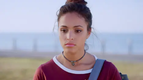 Sad depressed and upset tourist woman by the sea