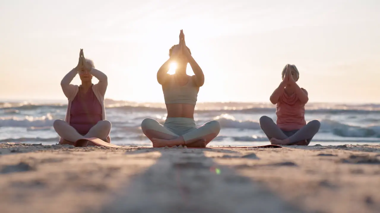 Beach yoga class sunset and meditation instructor