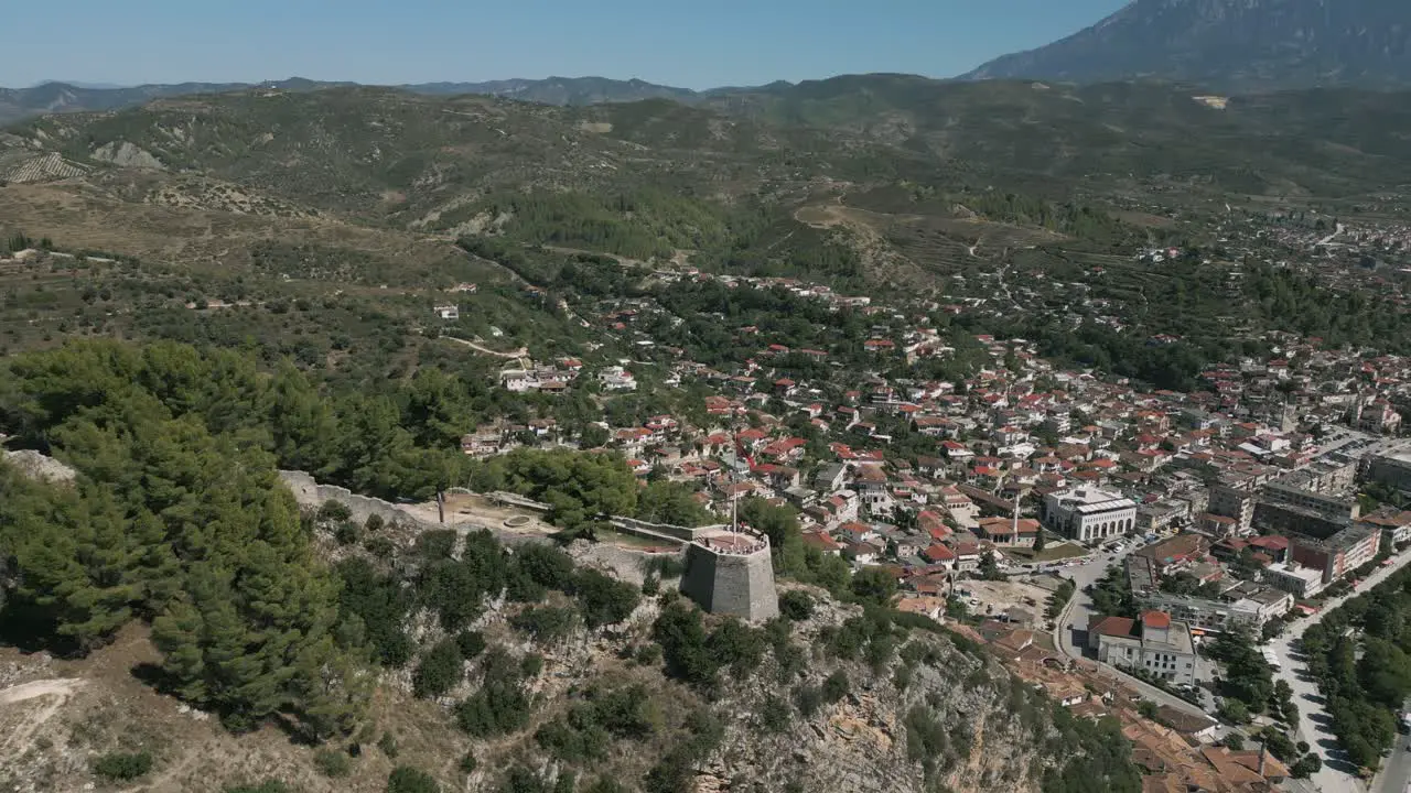 Aerial shot of viewpoint above Berat city with ancient buildings below