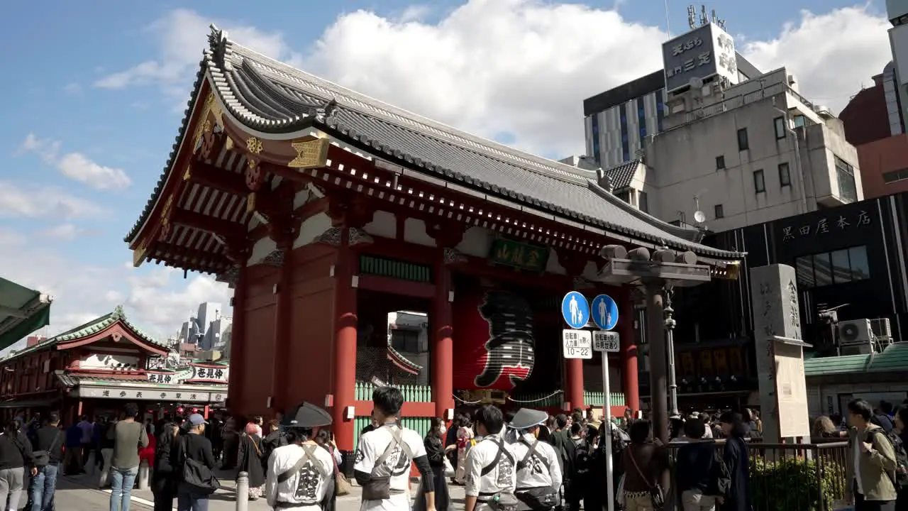 The Kaminarimon is the outer of two large entrance gates that ultimately leads to the Sensō-ji in Asakusa with tourists walking past