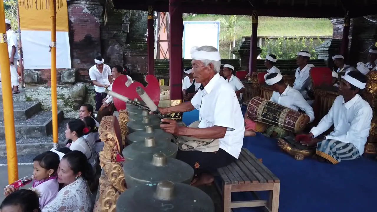 Balinese Old Musicians Play Traditional Gamelan Orchestra in Hindu Temple Ritual at Bali Indonesia