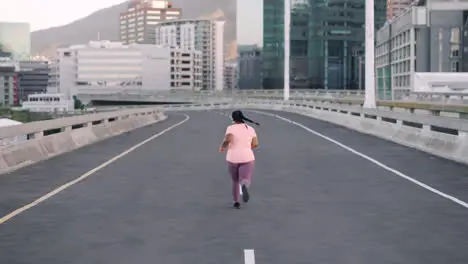 Plus size fitness woman or running on city road