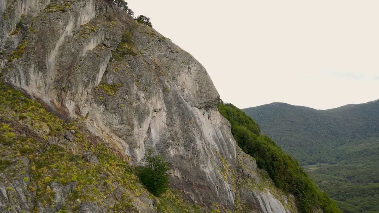 Aerial view of people climbing on rock