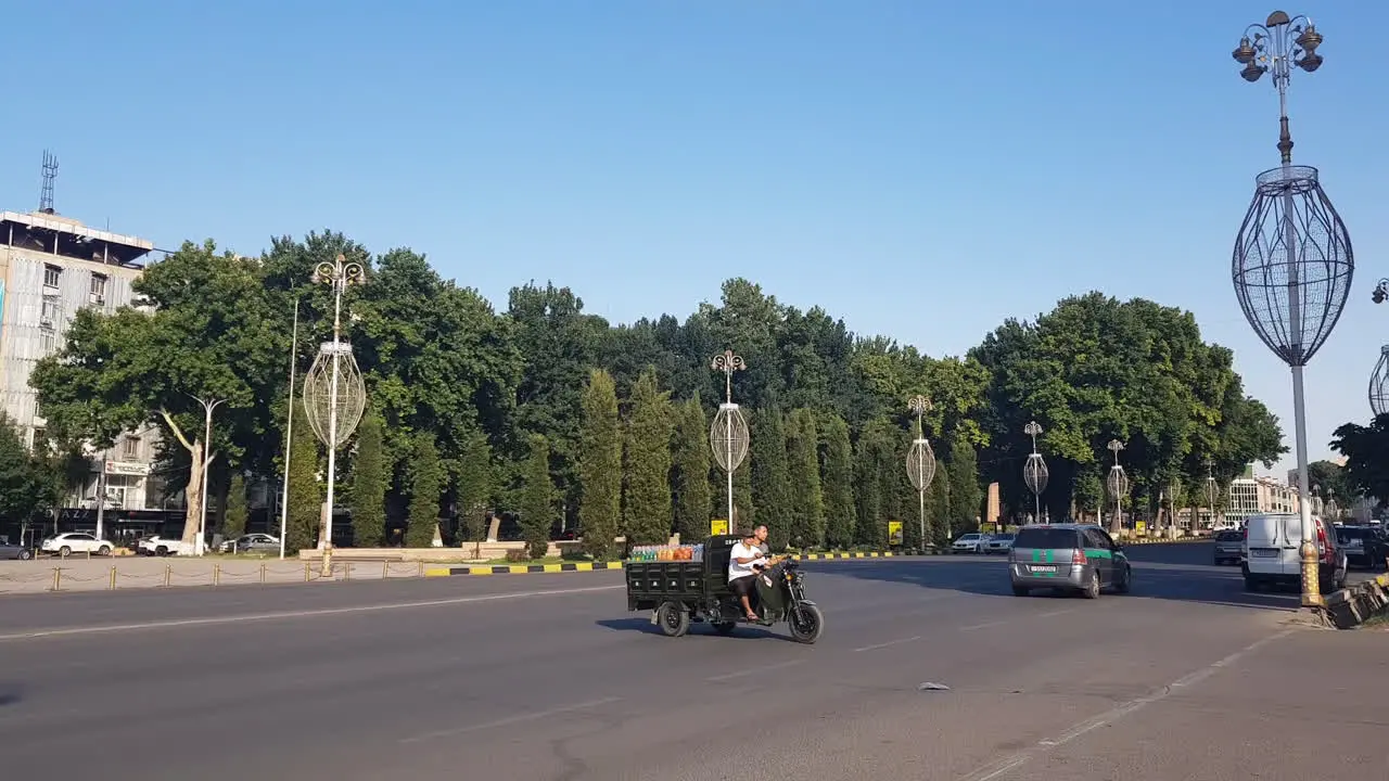 City Street Traffic in Khujand Tajikistan on Sunny Day Cars and Vehicles on the Road