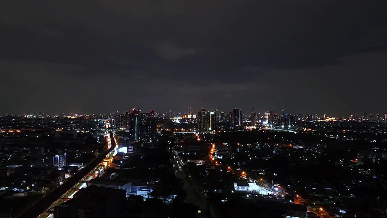 Nightlapse of the city Bangkok with the skyline and lights cars trains 4k video