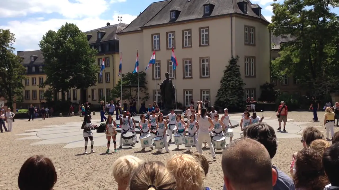 Drummer Band Playing Music on Square in Front of Audience on Sunny Summer Day