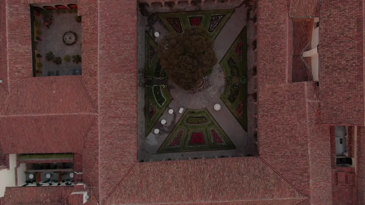 4K aerial view over a beautiful decorated inside garden of a spanish colonial house in the city centre of Cusco capital of the incas