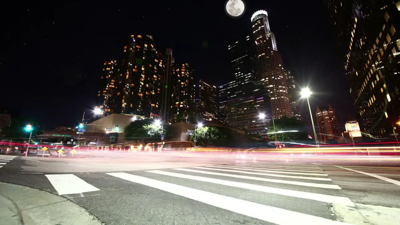 A time lapse of Downtown LA at night during a full moon