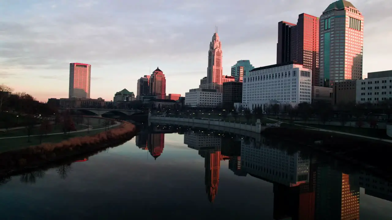 Drone at sunrise downtown Columbus reflected on river