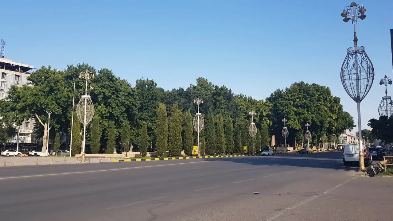 Daily Traffic in Downtown Neighborhood of Khujand City Tajikistan Wide View