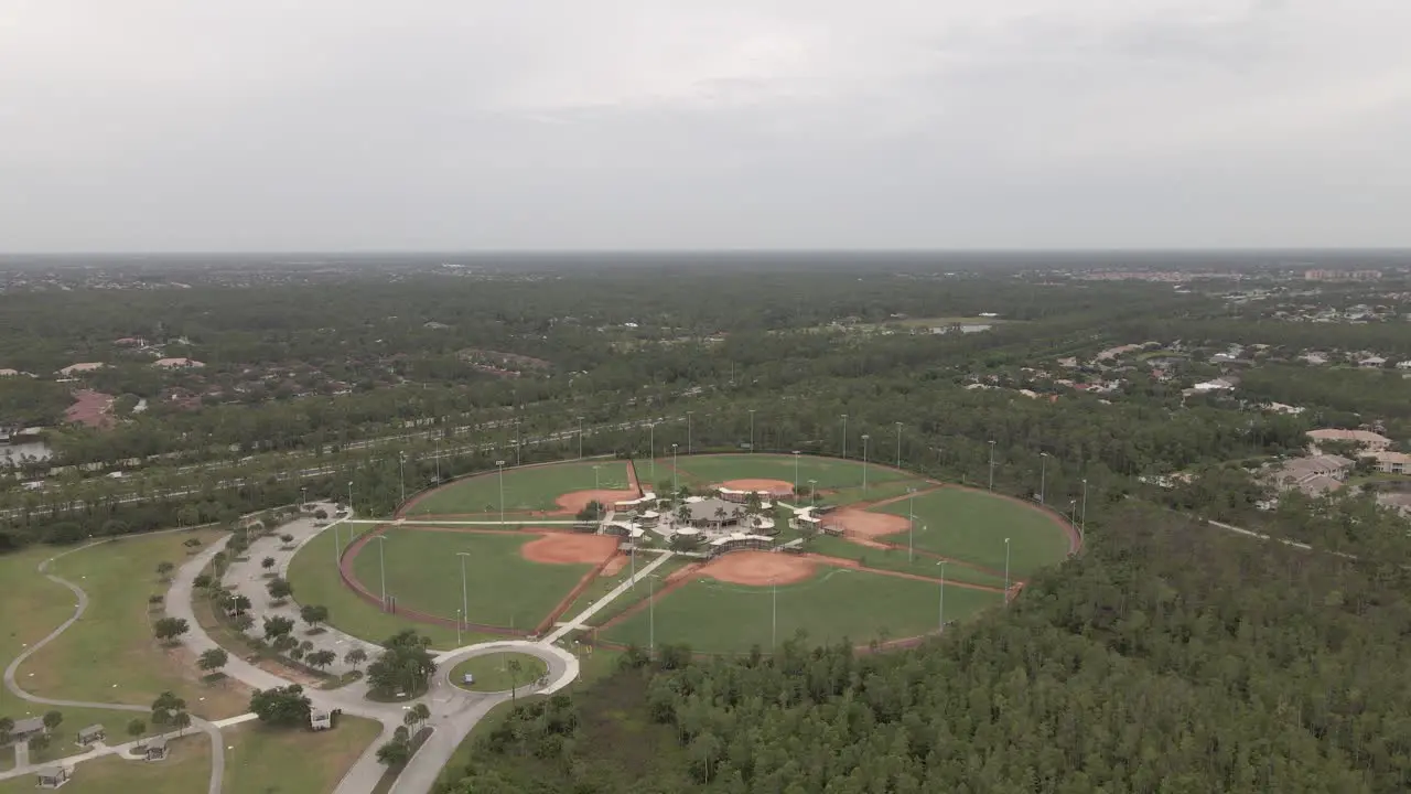 Aerial flight to modern sport complex with four baseball diamonds