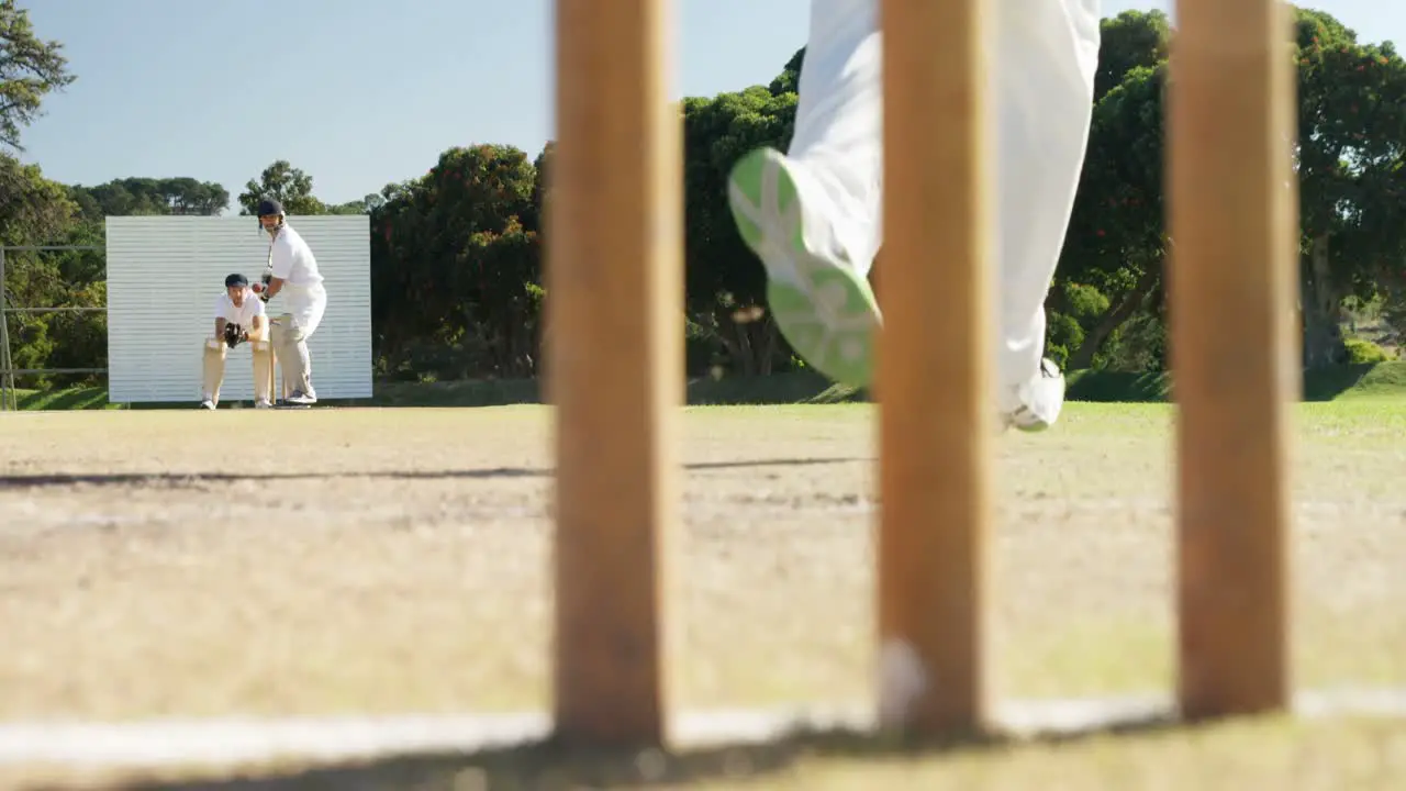 Bowler delivering ball during cricket match