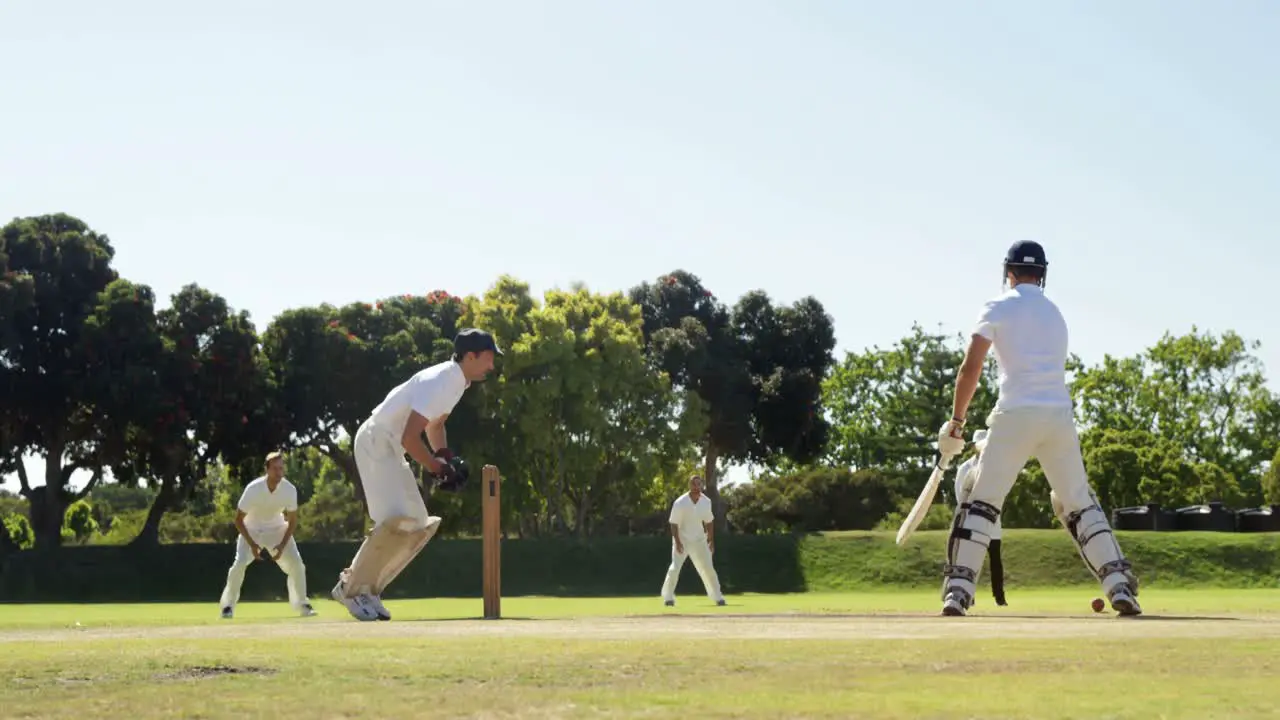 Batsman hitting a ball during cricket match