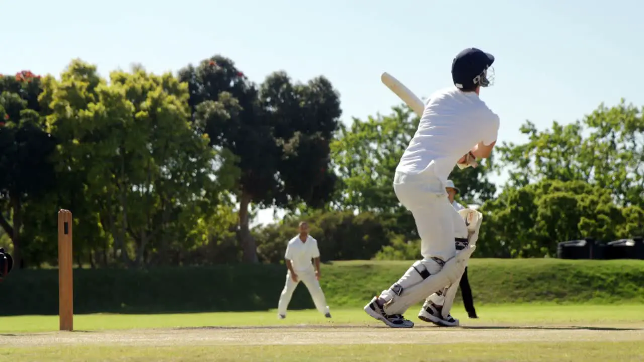 Wicket keeper taking a catch during cricket match