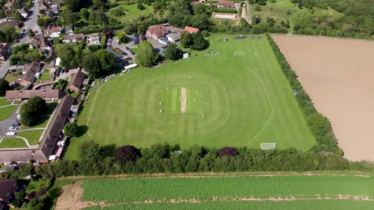 4K drone video of a sunny village cricket match in Kent England