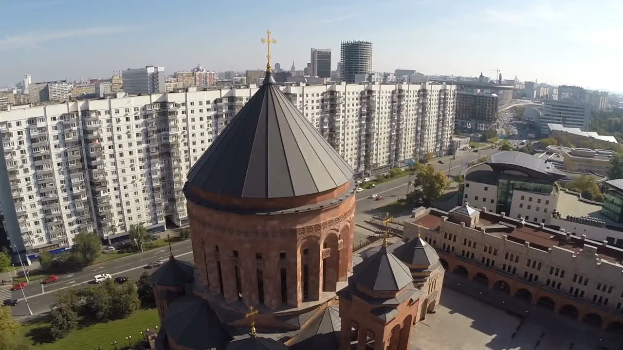 Flying over Orthodox church in the city