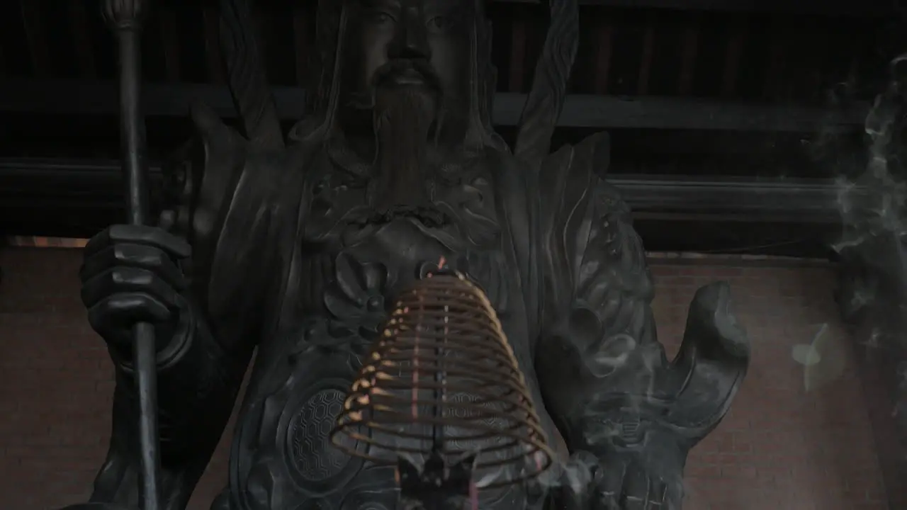 Incense and statue of warrior in Bai Dinh Temple Vietnam