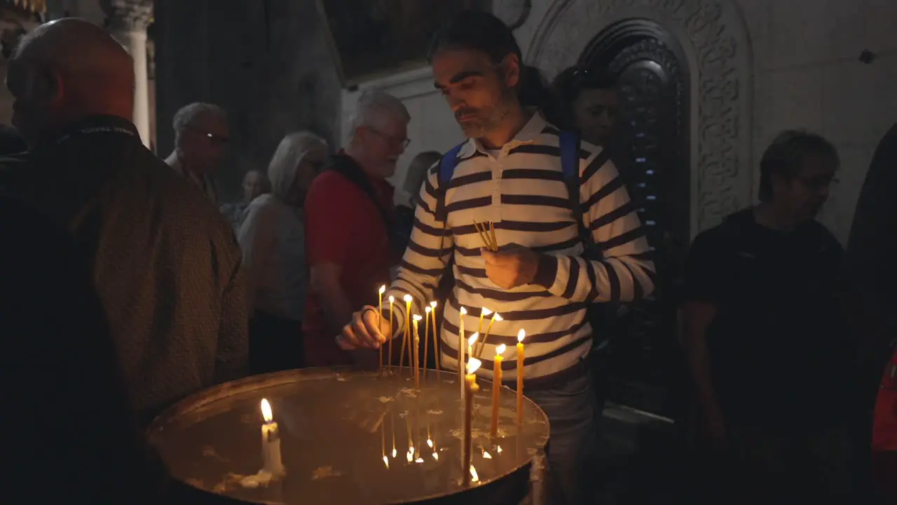 Burning Candles Inside The Church Of The Holy Sepulchre