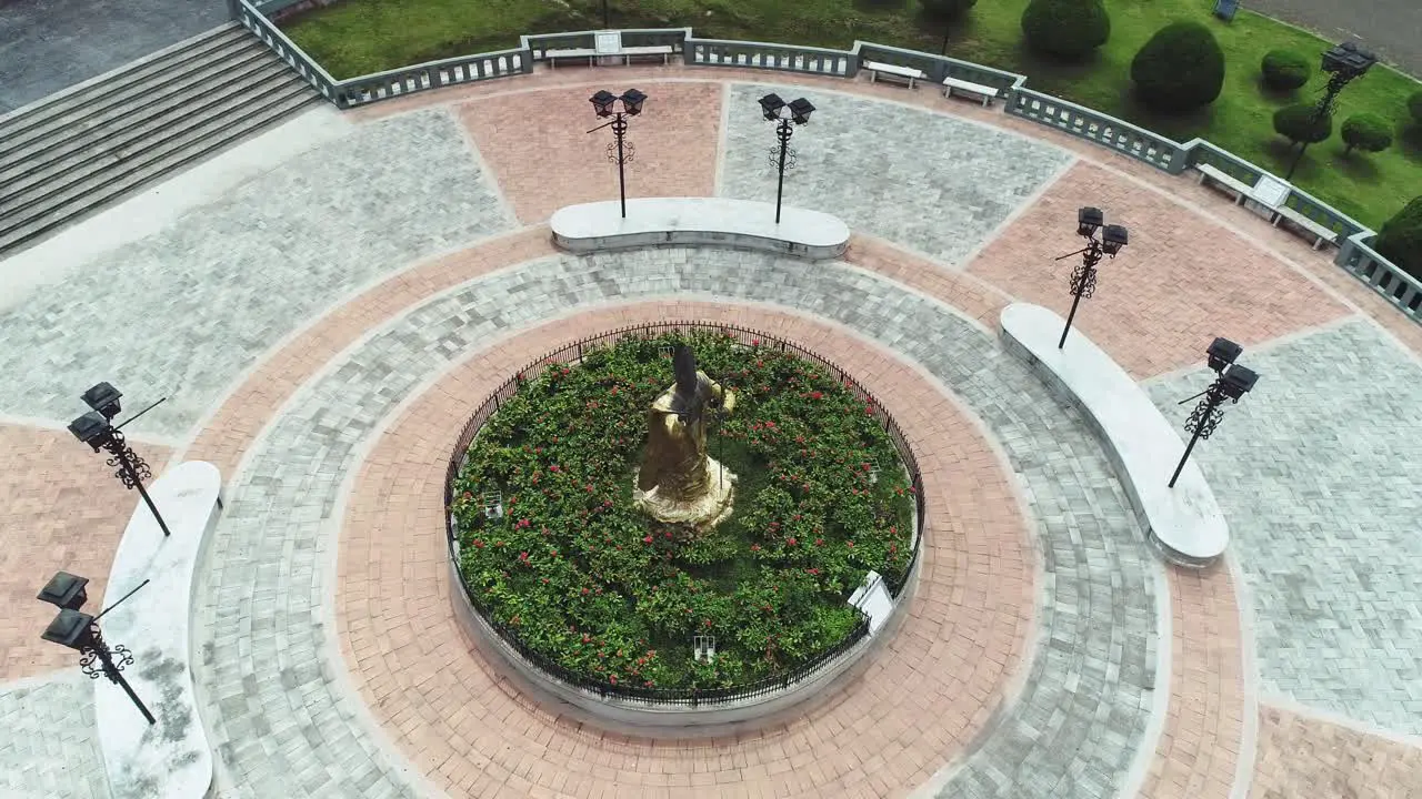 AERIAL Aerial high angle shot of cathedral plaza with statue