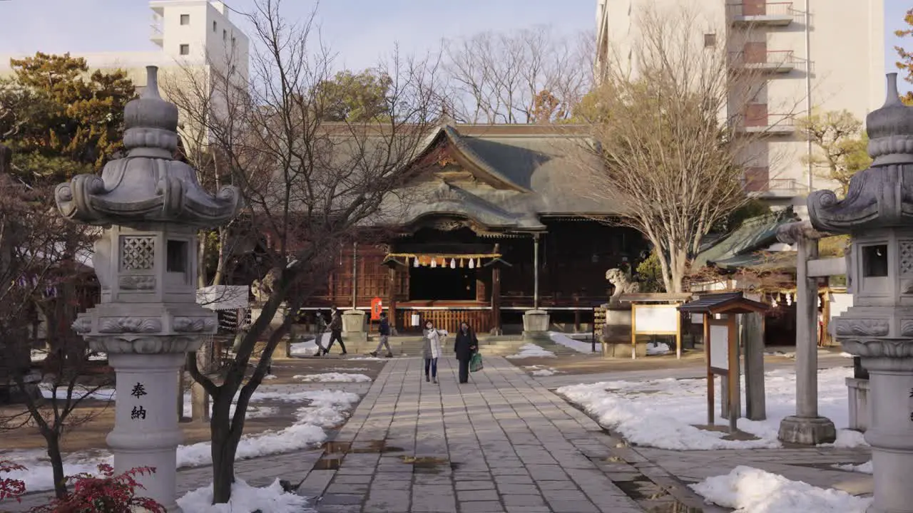 Temple in Matsumoto Japan Pan shot across snowy grounds in the morning