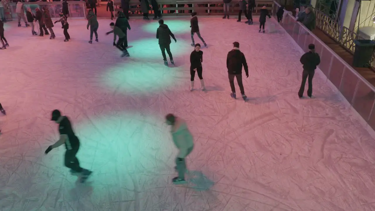 top view Dutch people ice skating on December Christmas market in Maastricht