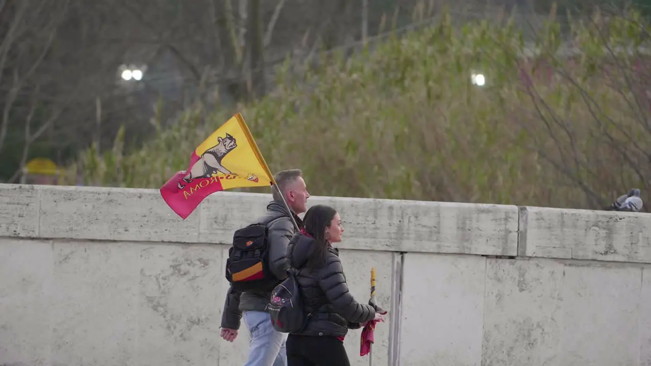 Football Fans Walking With Flag