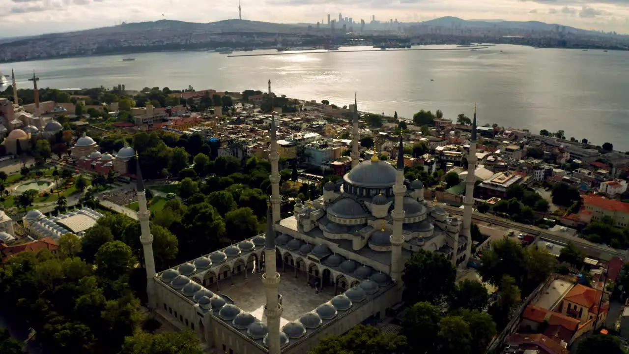 Aerial serenity Istanbul's Blue Mosque stands in tranquil elegance as the sun sets casting a mesmerizing glow over its intricate architecture