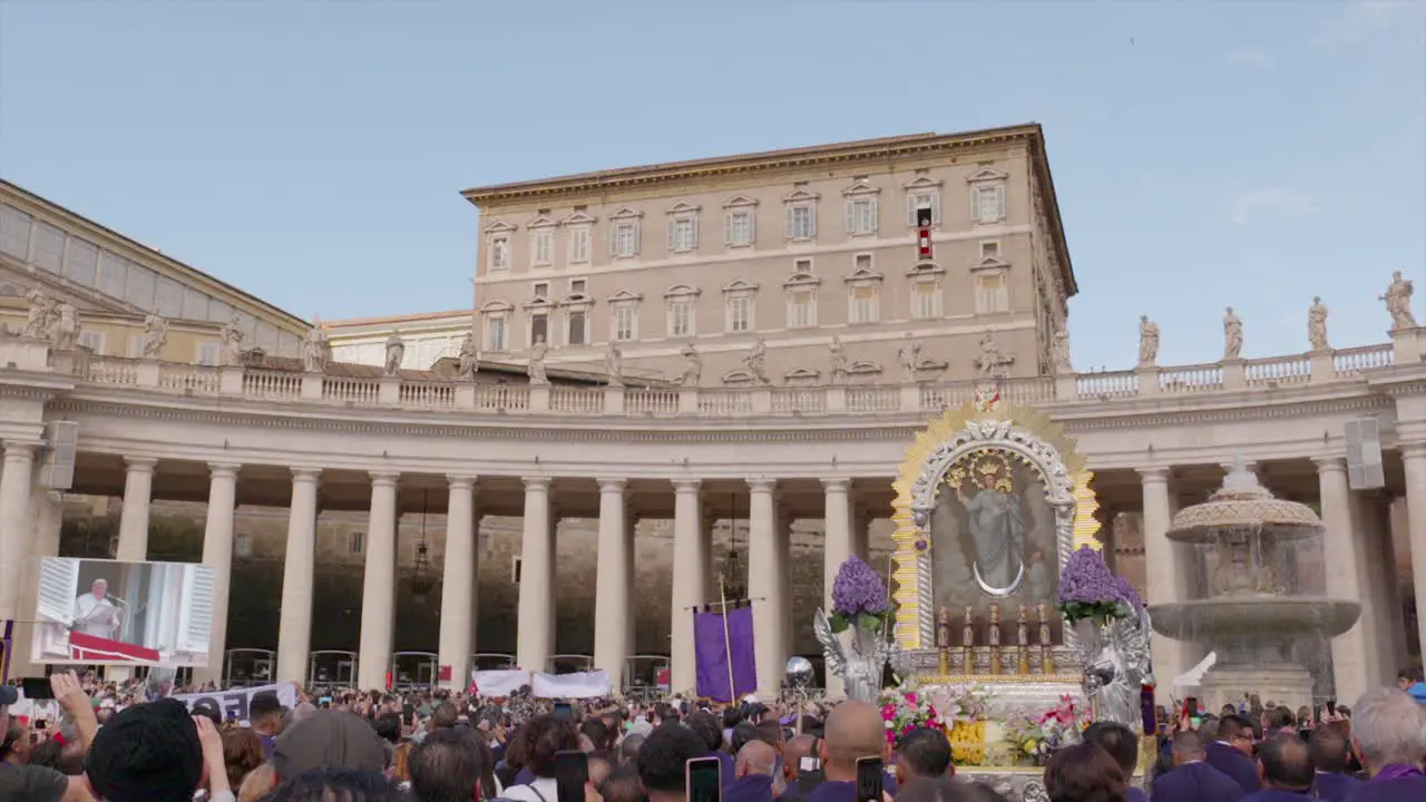 Pope Francis delivering an address in Italian at noon from Saint-Peter square in the Vatican with the image of Lord of the miracles in the foreground