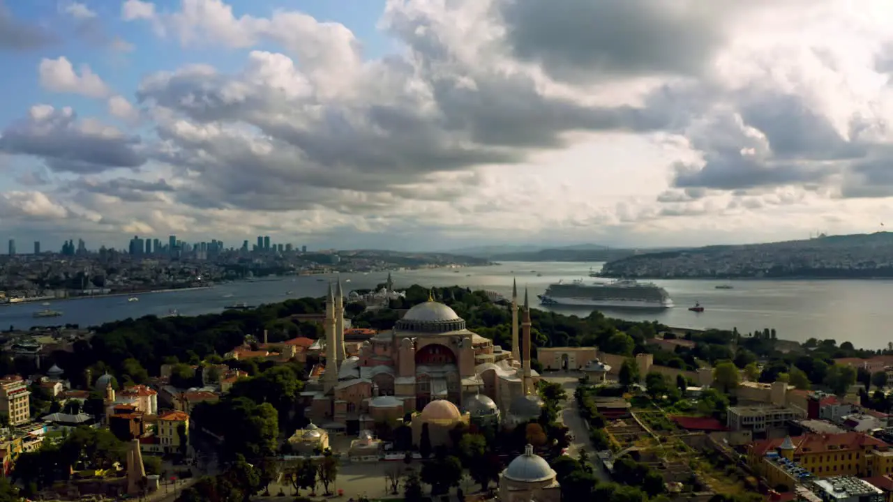 Aerial drone vistas reveal Istanbul's Blue Mosque as twilight descends with majestic clouds adding a dramatic backdrop to its timeless beauty