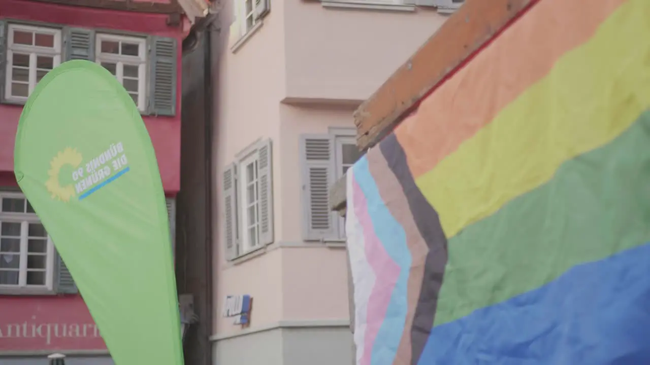 LGBTQ+ flag and flag of the political party Bündnis 90 Die Grünen