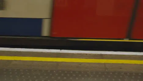 Close Up Of Tube Train Leaving Platform At Underground Station Of London Euston UK