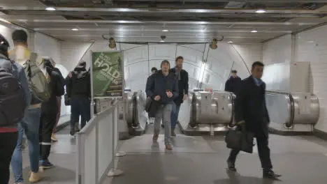 Commuter Passengers On Escalators At Underground Station Of London Liverpool Street UK