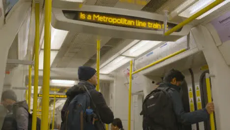 Information Display Inside Tube Train Carriage On Metropolitan Line London UK With Commuters