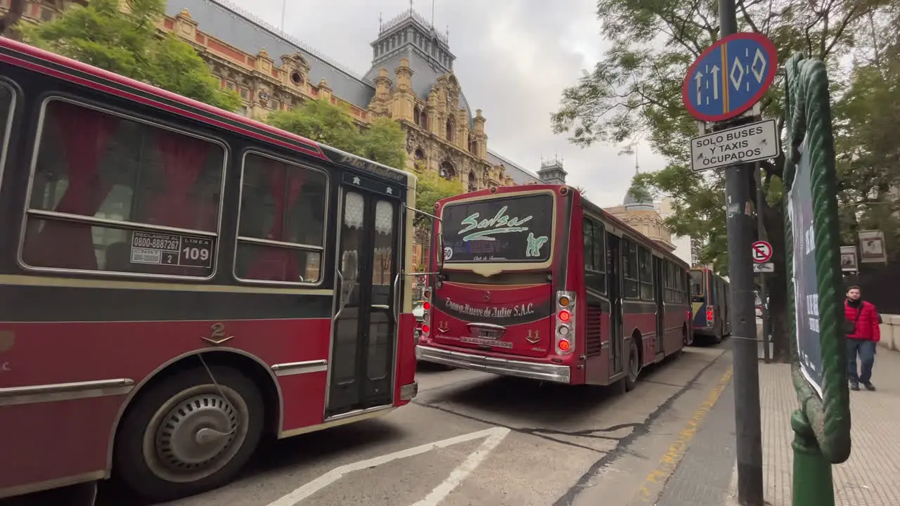 Red buses stand in a traffic jam public transport the center of Buenos Aires